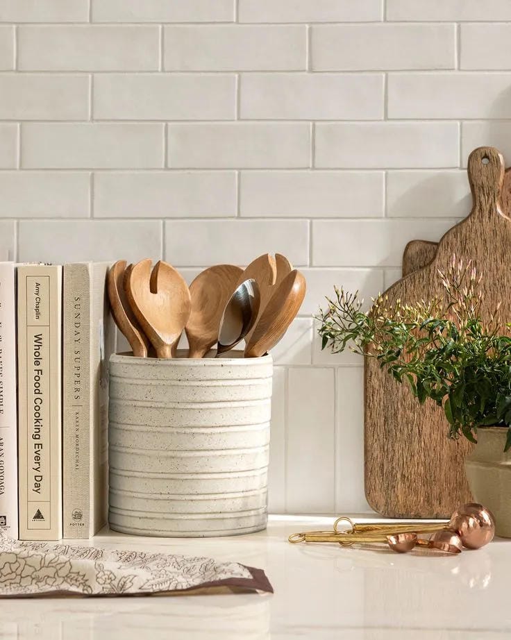 kitchen counter organization ideas with utensil crock cutting boards plant and cookbook