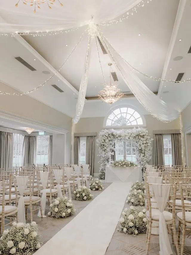 modern wedding aisle decor with romantic floral styling