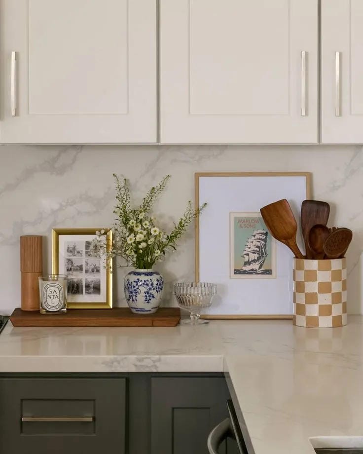 kitchen counter decor ideas with framed art wood utensils vase and candle