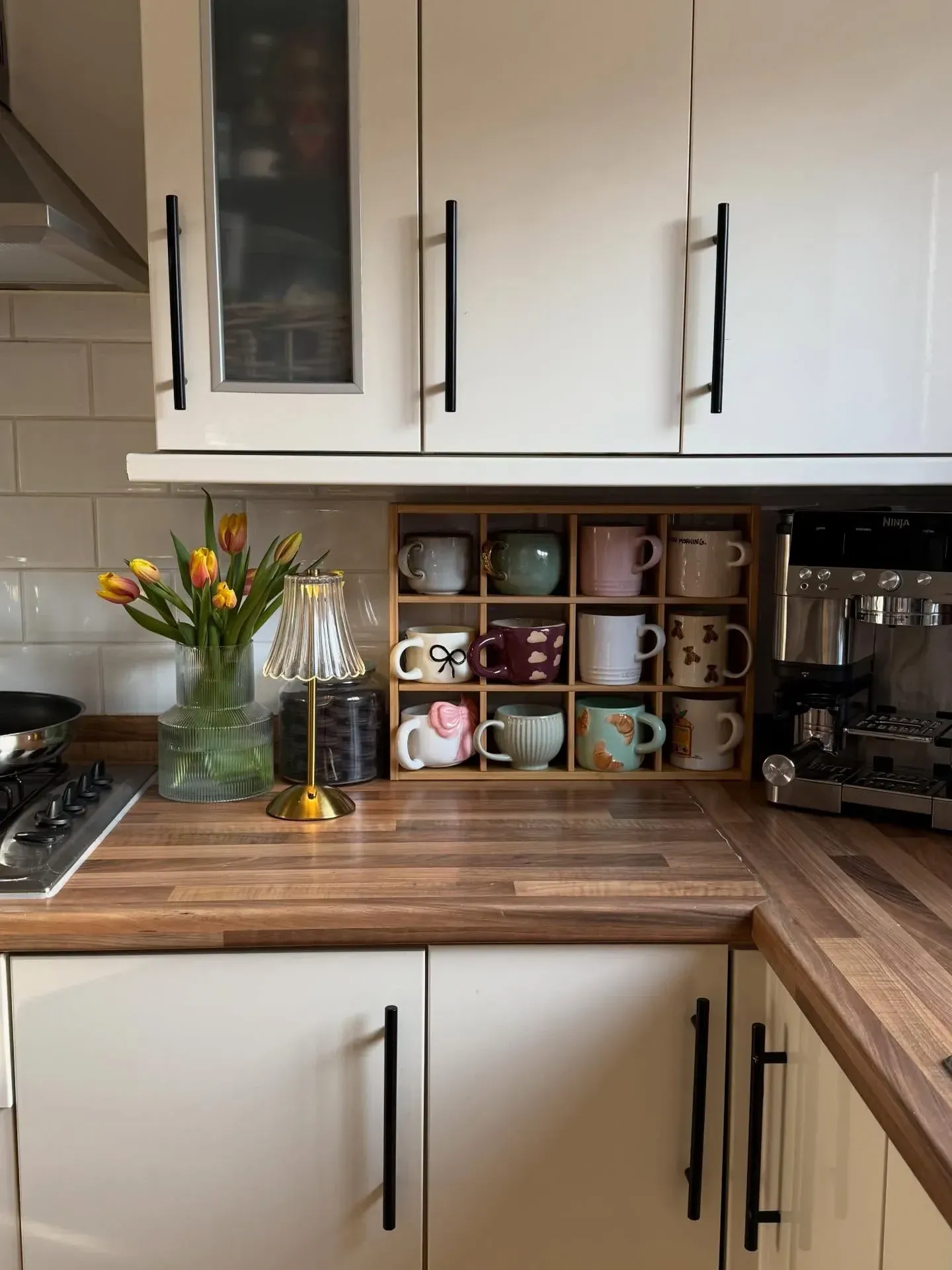 corner coffee station ideas with machine, mugs, jars, and small kitchen counter