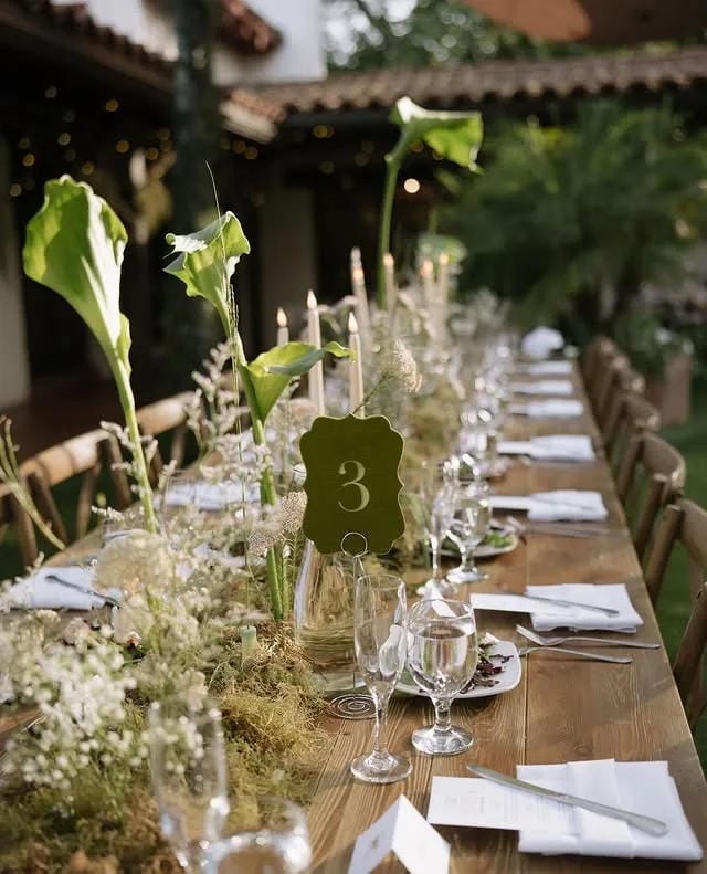 country wedding table centerpiece with candles and florals