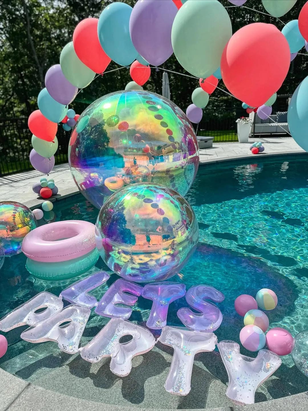 pool party decor ideas with make a balloon arch over the water