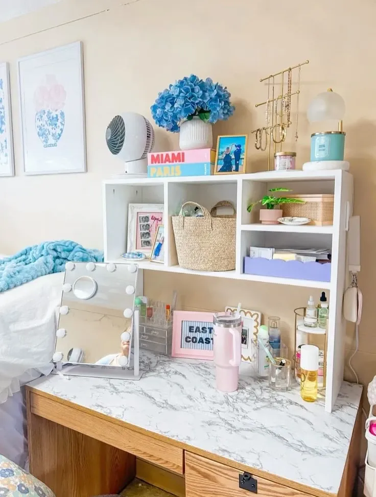 dorm desk ideas with blue accents white shelves storage bins and flowers