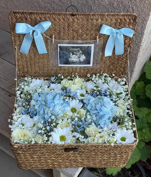 boy baby shower basket with blue flowers and ultrasound photo