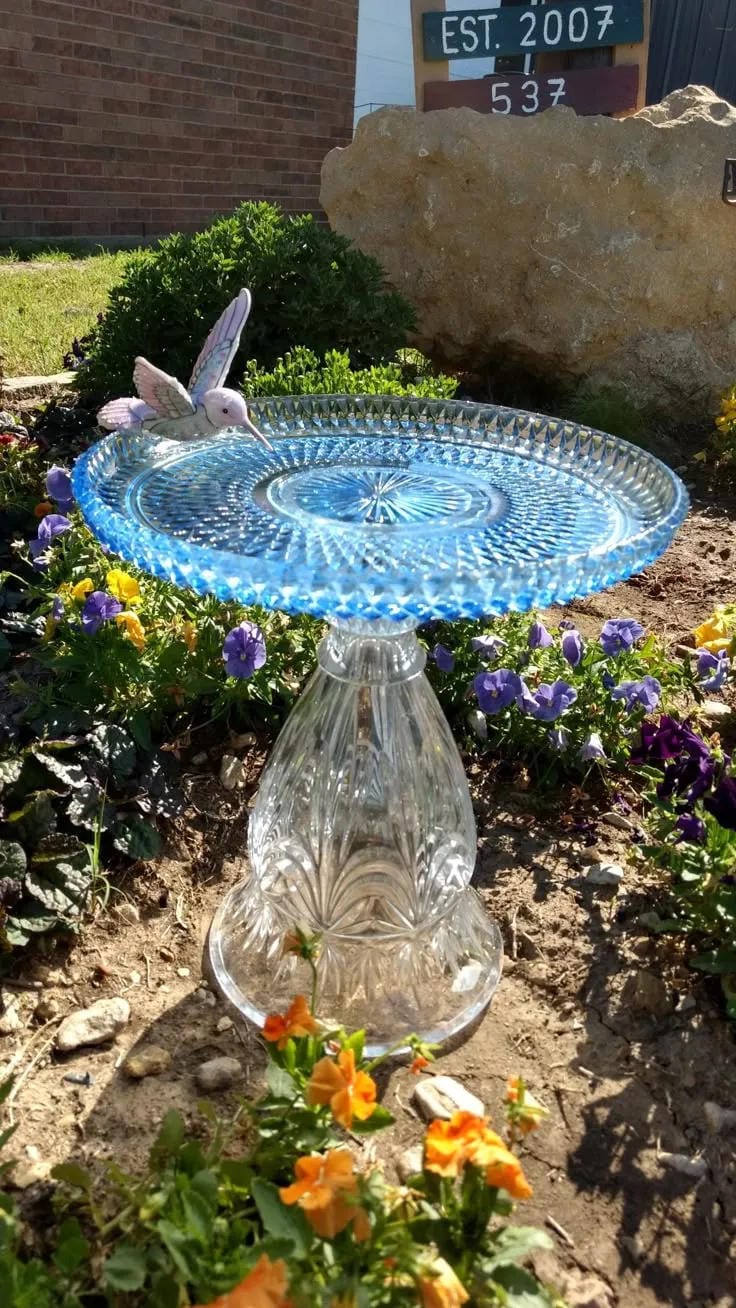 DIY bird bath idea with blue glass platter and clear vase pedestal