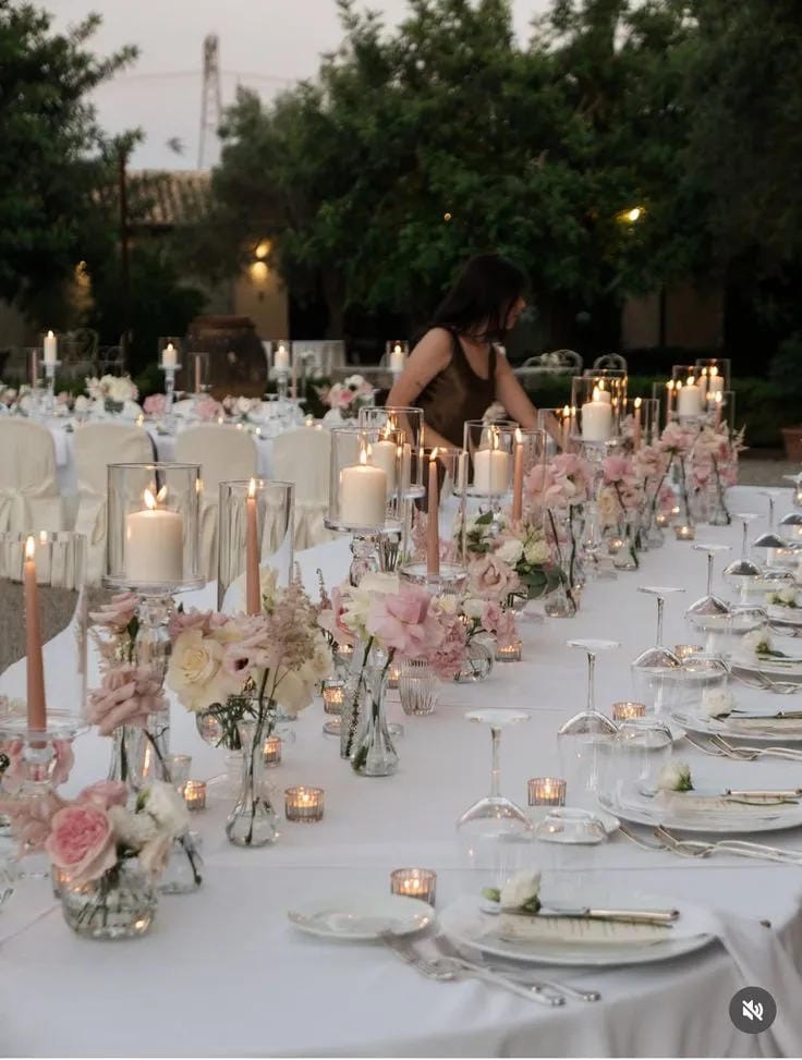 outdoor wedding table decor with candles and greenery