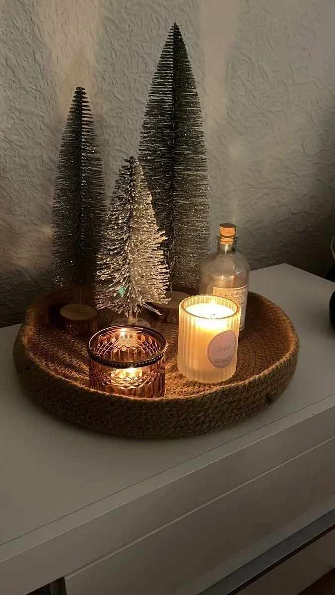Miniature Christmas trees and candlelight for Scandinavian Christmas decor