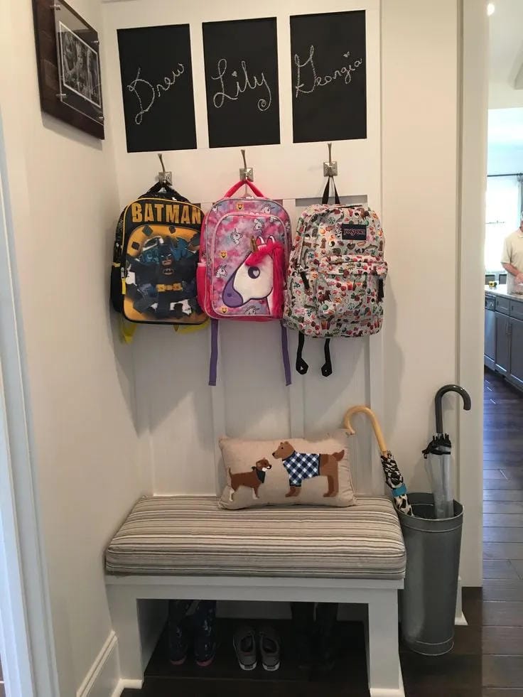 organized entryway for school bags and lunch boxes