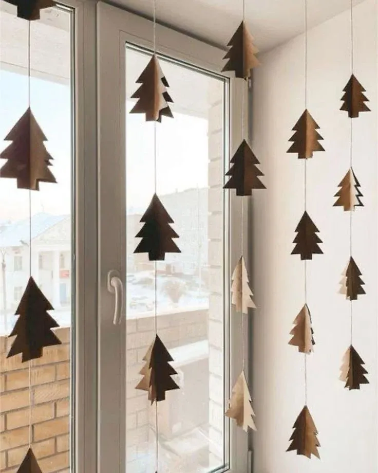 Paper Christmas trees in a window for Scandinavian Christmas decor