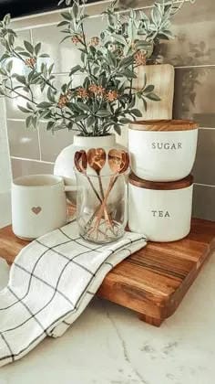kitchen counter organization ideas with sugar tea canisters wood tray and mugs