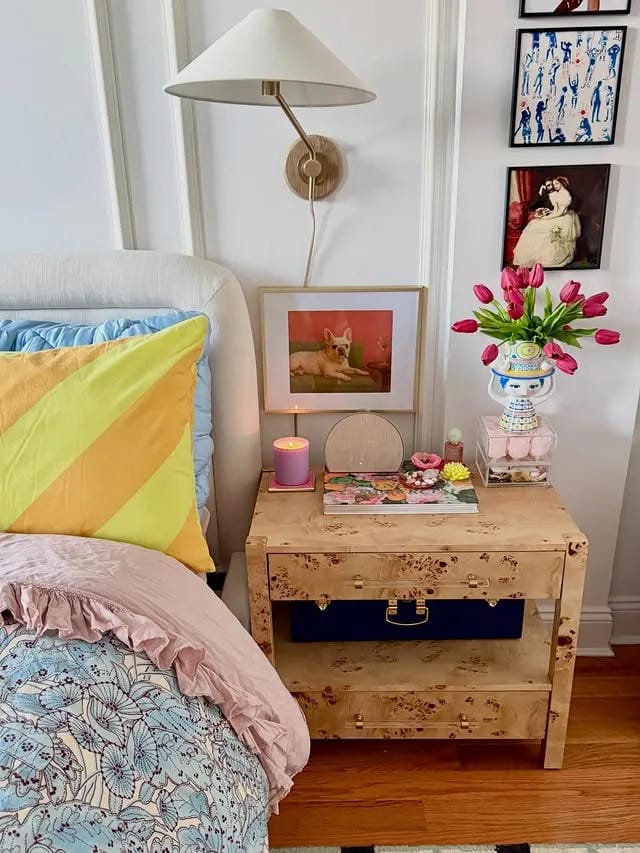 nightstand decor ideas with colorful bedding flowers candle artwork and rustic table