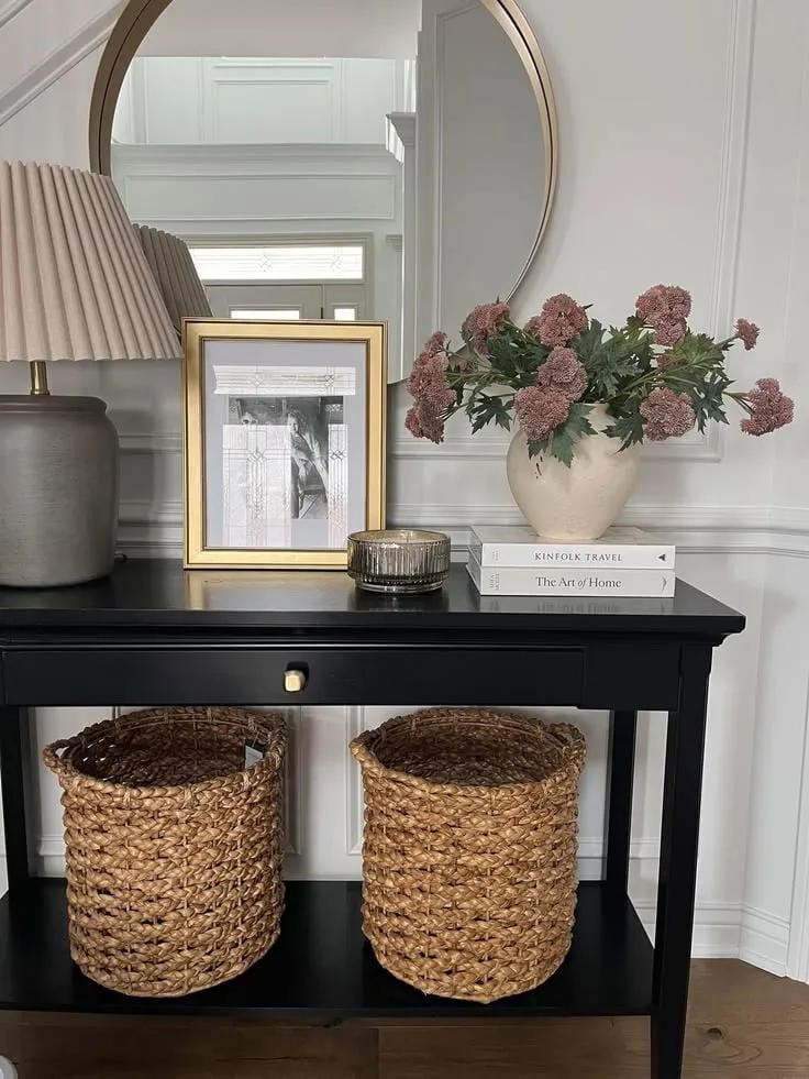 entryway table decor with black console pink flowers baskets lamp and mirror