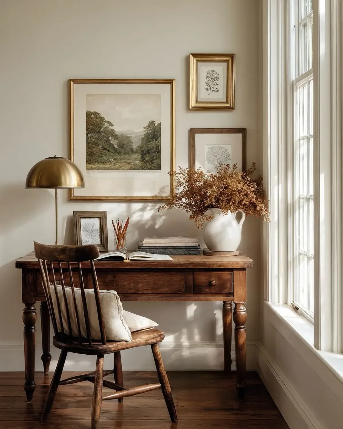 cottage vintage home decor ideas with wooden desk, chair, lamp, framed art, and curtains