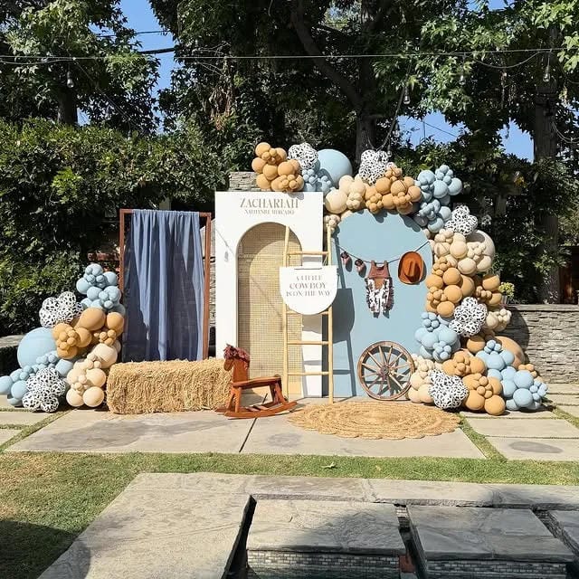 cowboy themed boy baby shower backdrop with balloons