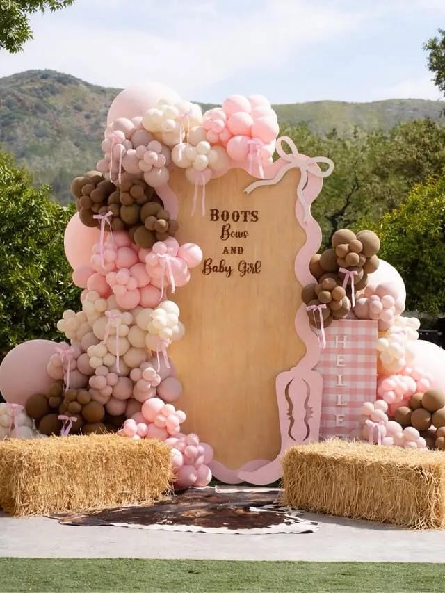 pink cowgirl girl baby shower backdrop with balloons