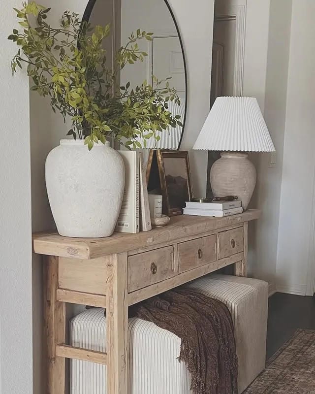 entryway table decor with lamp large vase branches books and stool