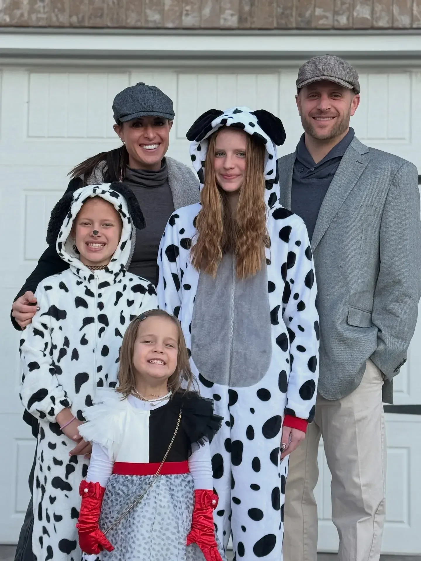funny halloween costumes for families with Cruella de Vil and dalmatian costumes