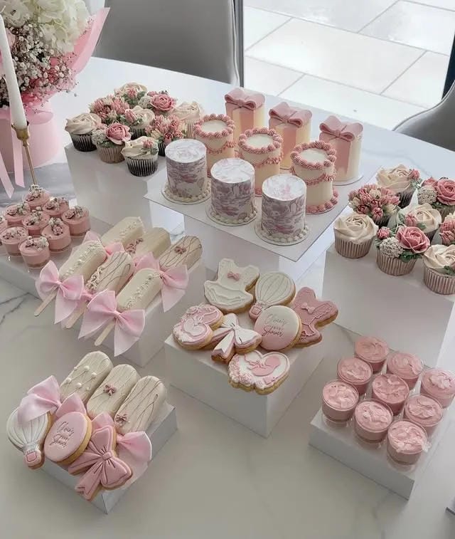 girl baby shower pastel dessert table with pink sweets