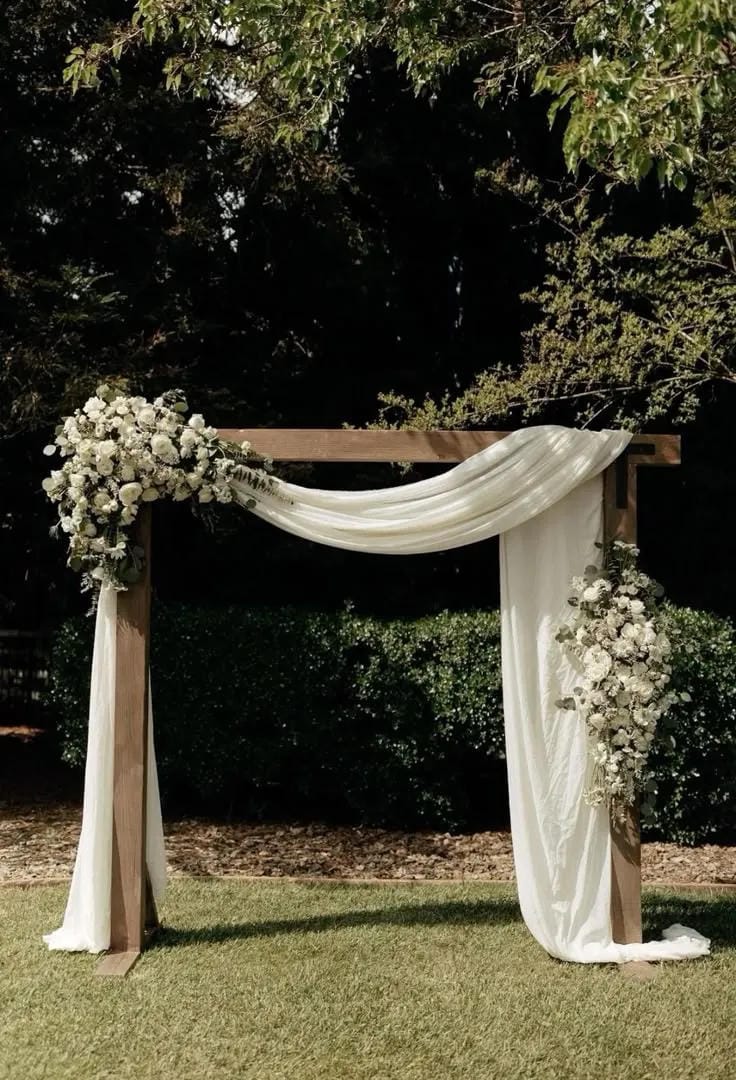 rustic wedding aisle decor with lanterns and greenery