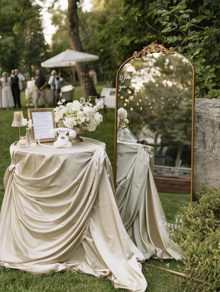 wedding welcome area decor with sign cards and flowers