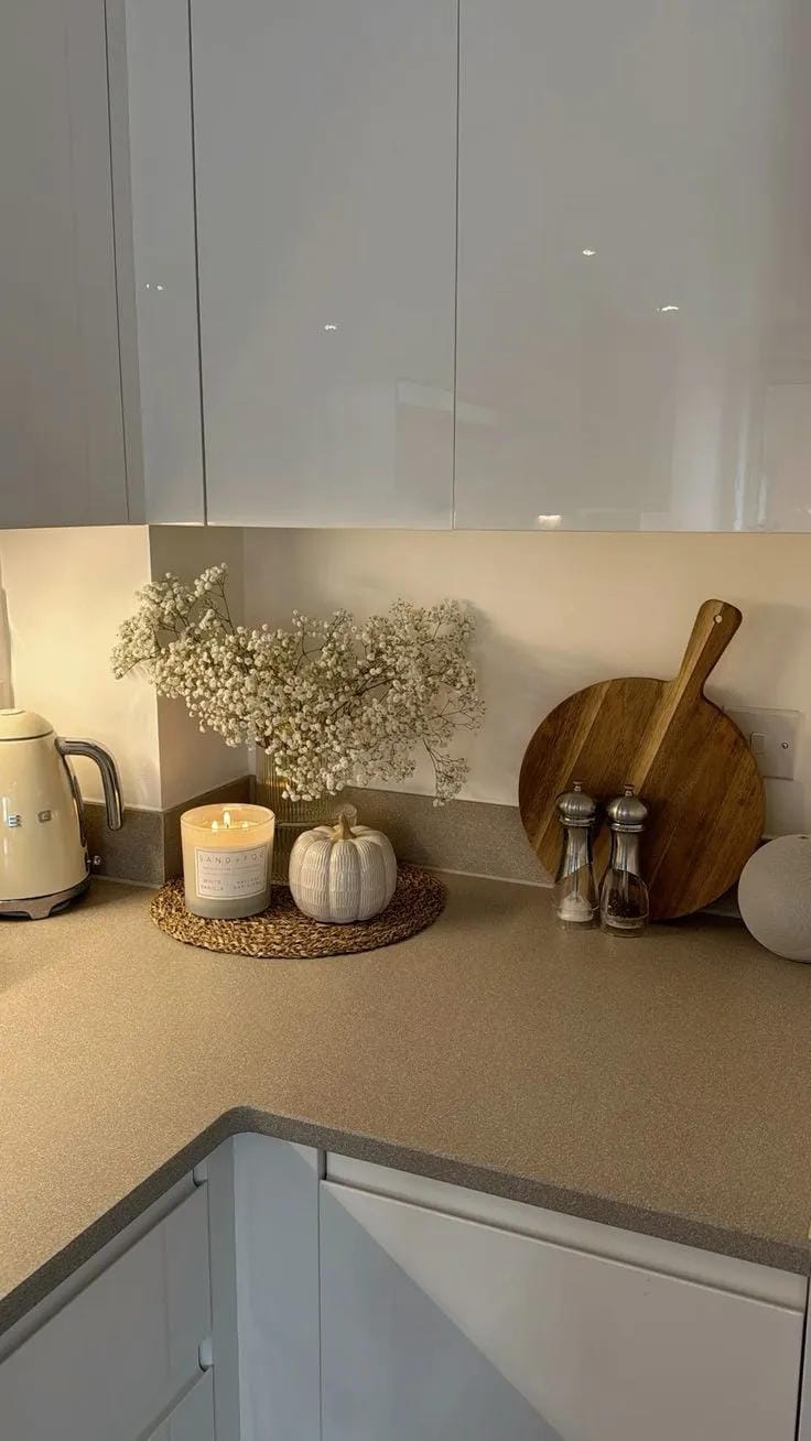 simple fall kitchen counter decor with candle white pumpkin baby
