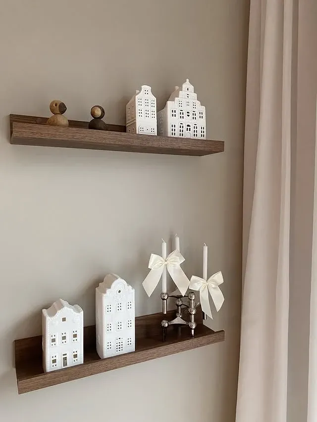 Paper Christmas houses on floating shelves for Scandinavian Christmas decor