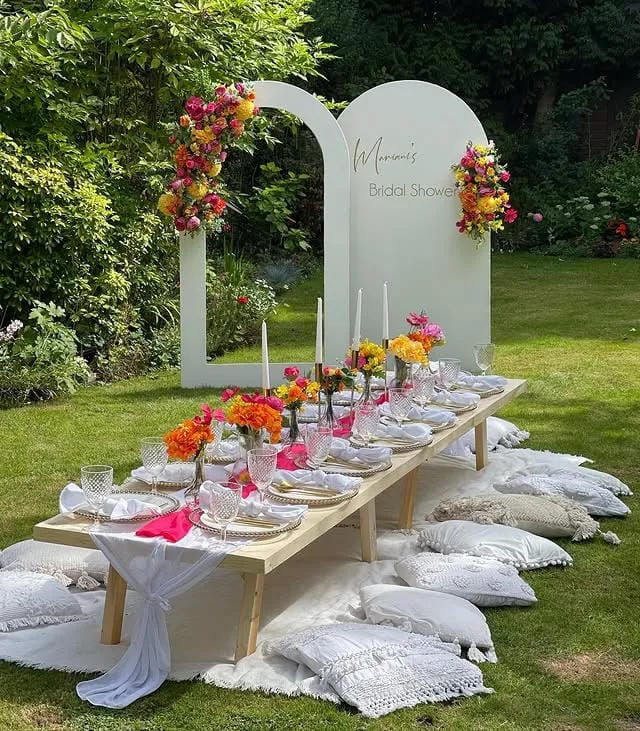 garden bridal shower idea with floral backdrop