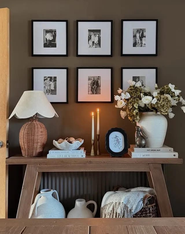 entryway table decor with gallery wall lamp flowers candles and wood console
