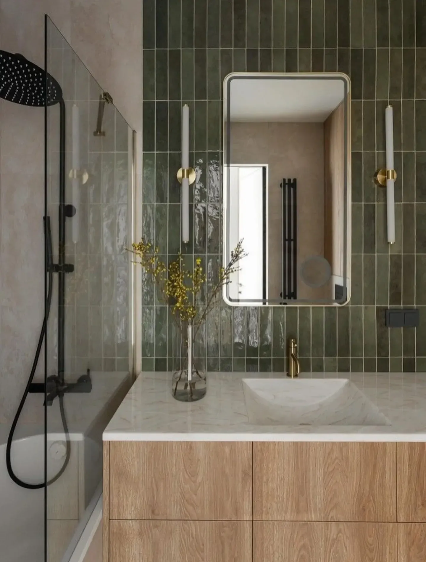 green bathroom ideas with glossy green tile, gold mirror, gold sconces, black shower fixture, and wood vanity