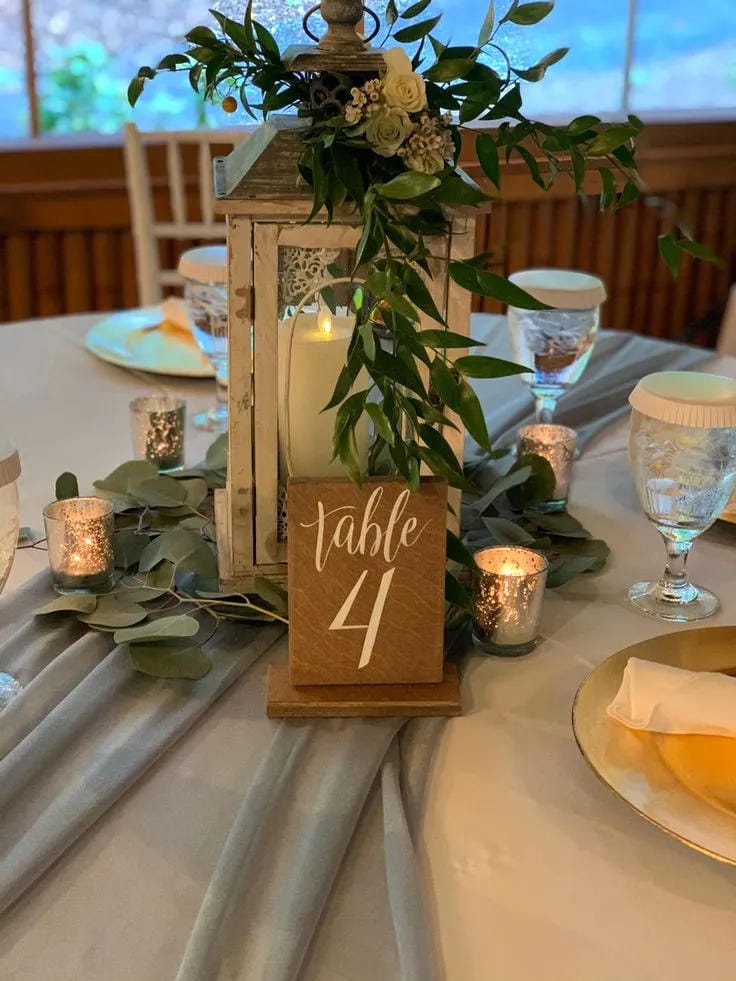 beautiful wedding tablescape with flowers candles and linens