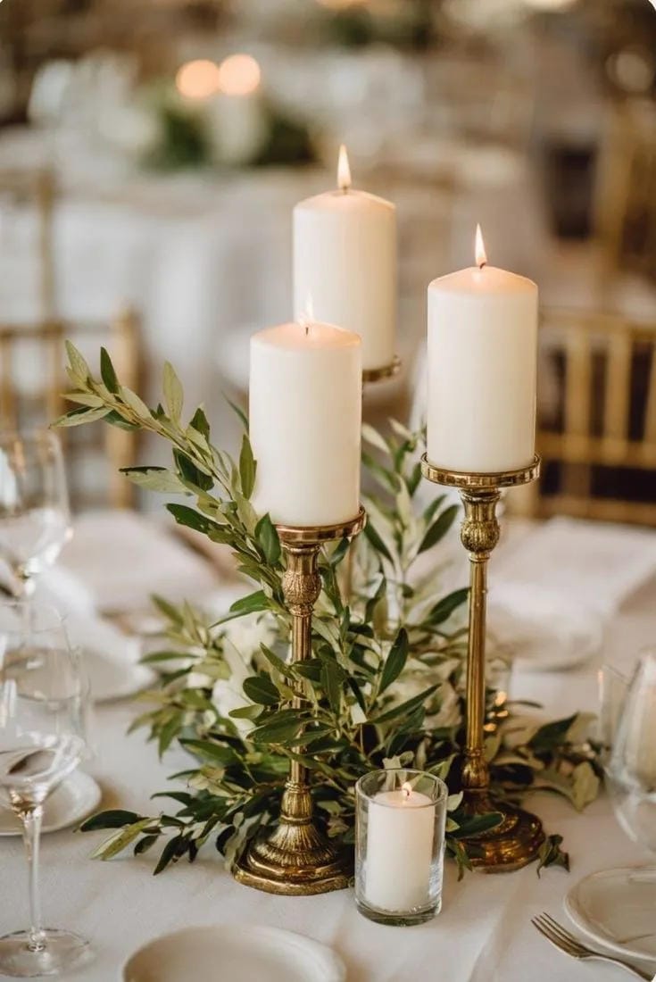 DIY wedding centerpiece with bud vases and taper candles