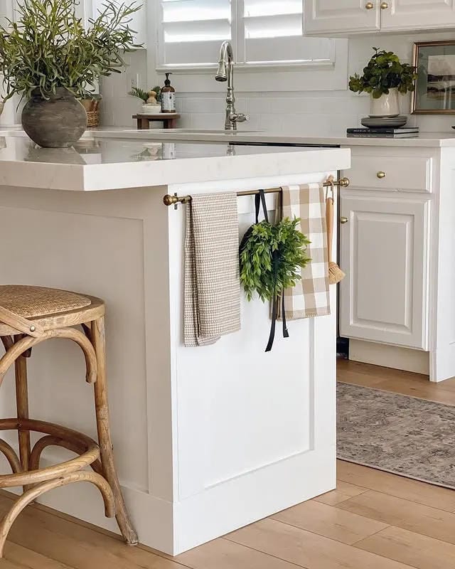 kitchen island organization ideas with towel rail hanging wreath and small counter plant