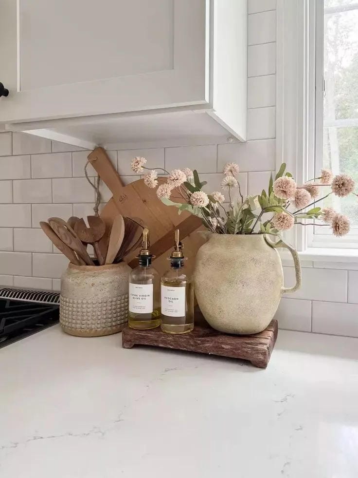kitchen counter organization ideas with wood tray oils utensils and flower vase