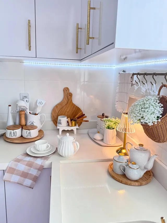 kitchen counter decor ideas with tea cups wooden tray flowers and under cabinet lights