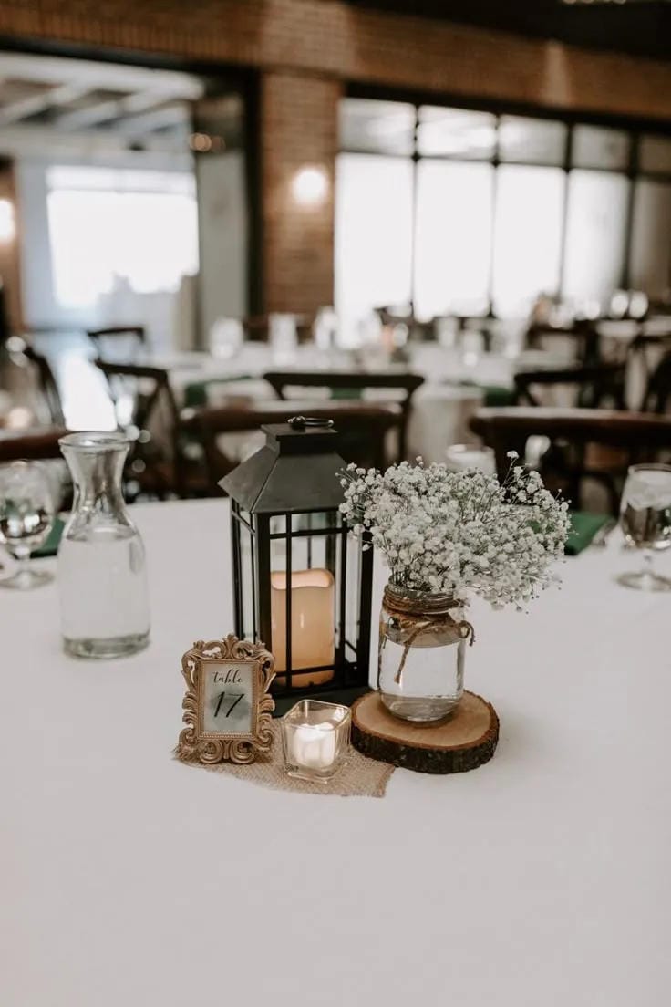 rustic mason jar centerpiece with burlap and flowers