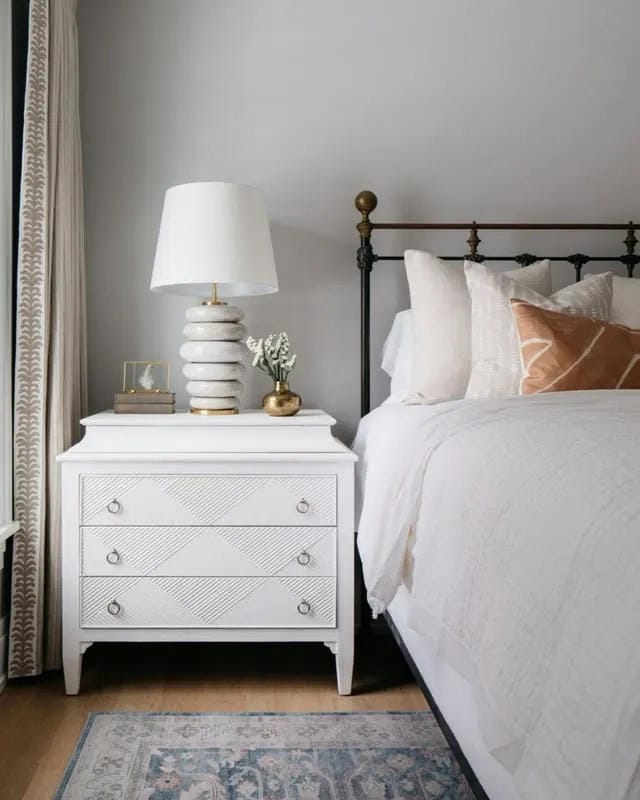 nightstand decor ideas with white dresser lamp flowers and cozy bedroom styling