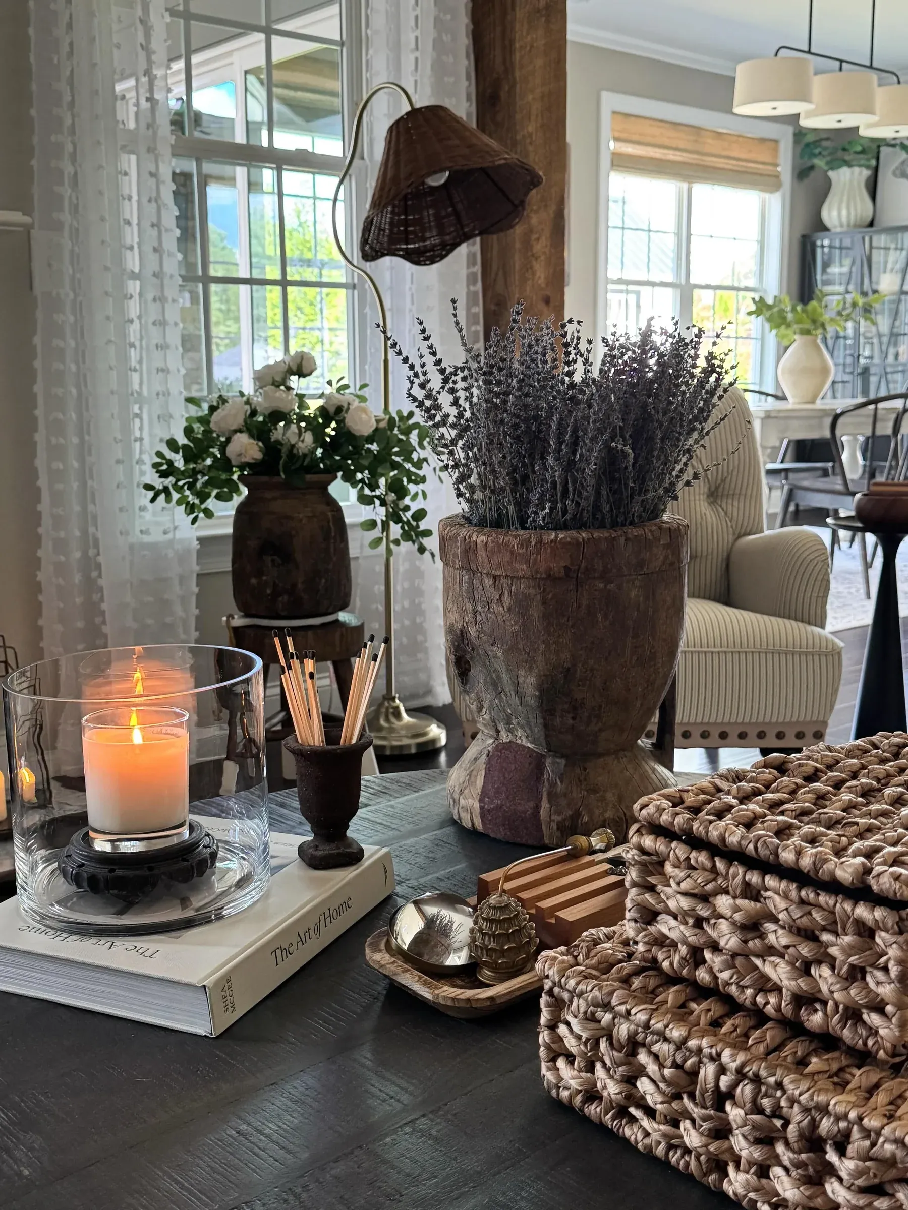 vintage home decor ideas with rustic vase, dried lavender, candle, woven baskets, and tabletop styling