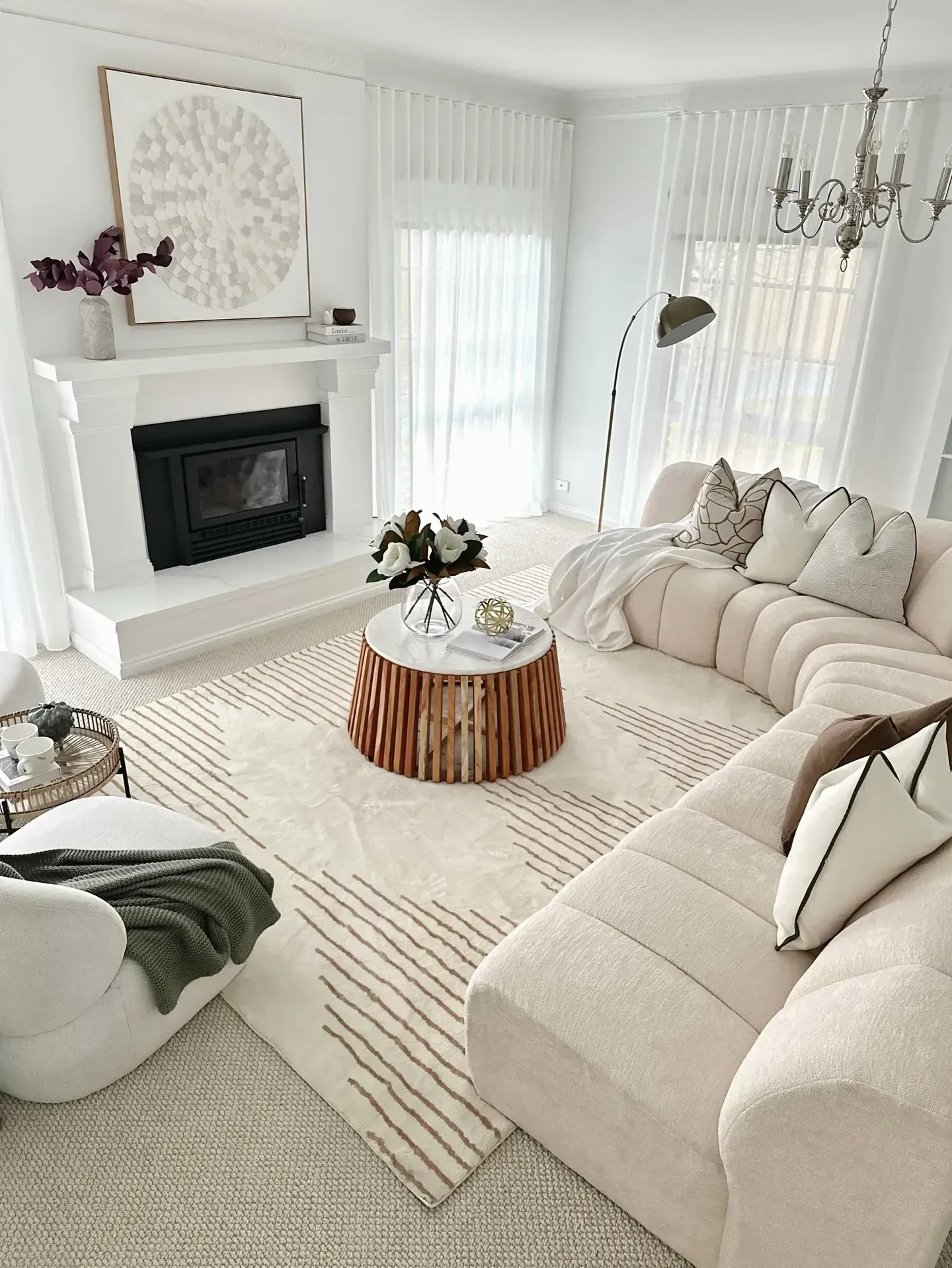 modern coastal living room ideas with white sofas, wood coffee table, and bright windows