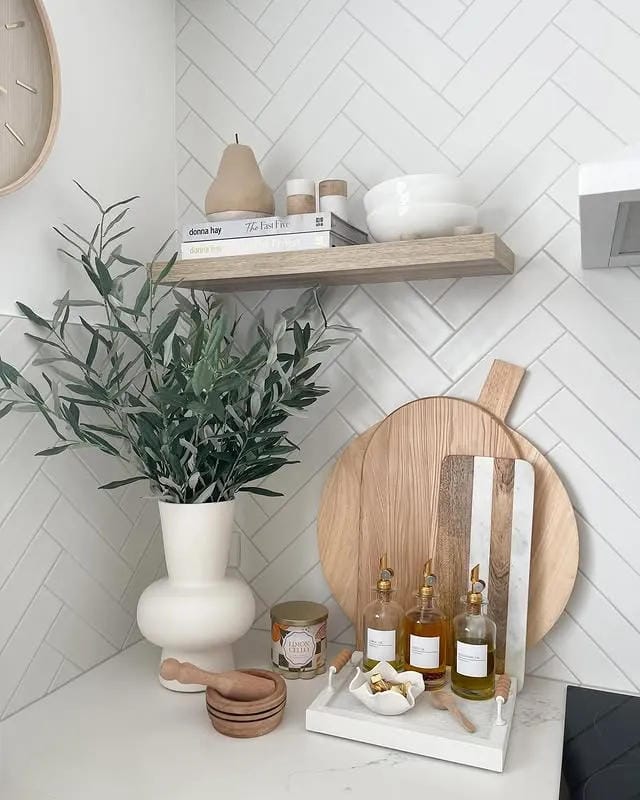 kitchen counter decor ideas with olive branches oils round cutting board and marble tray