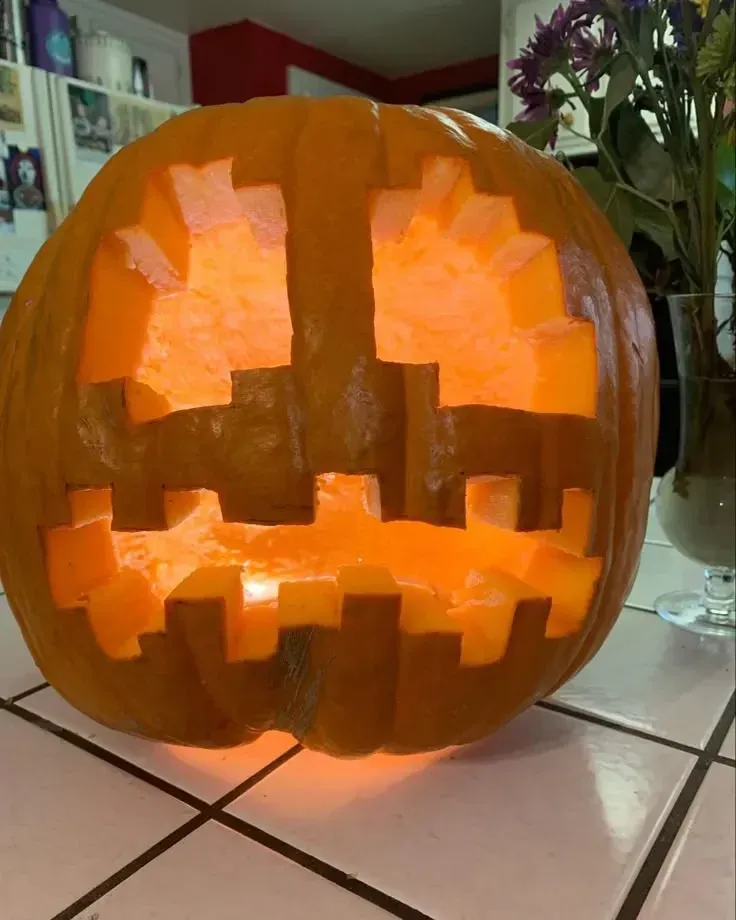 kid friendly pumpkin carving ideas with blocky jack o lantern face, square eyes, and chunky glowing mouth