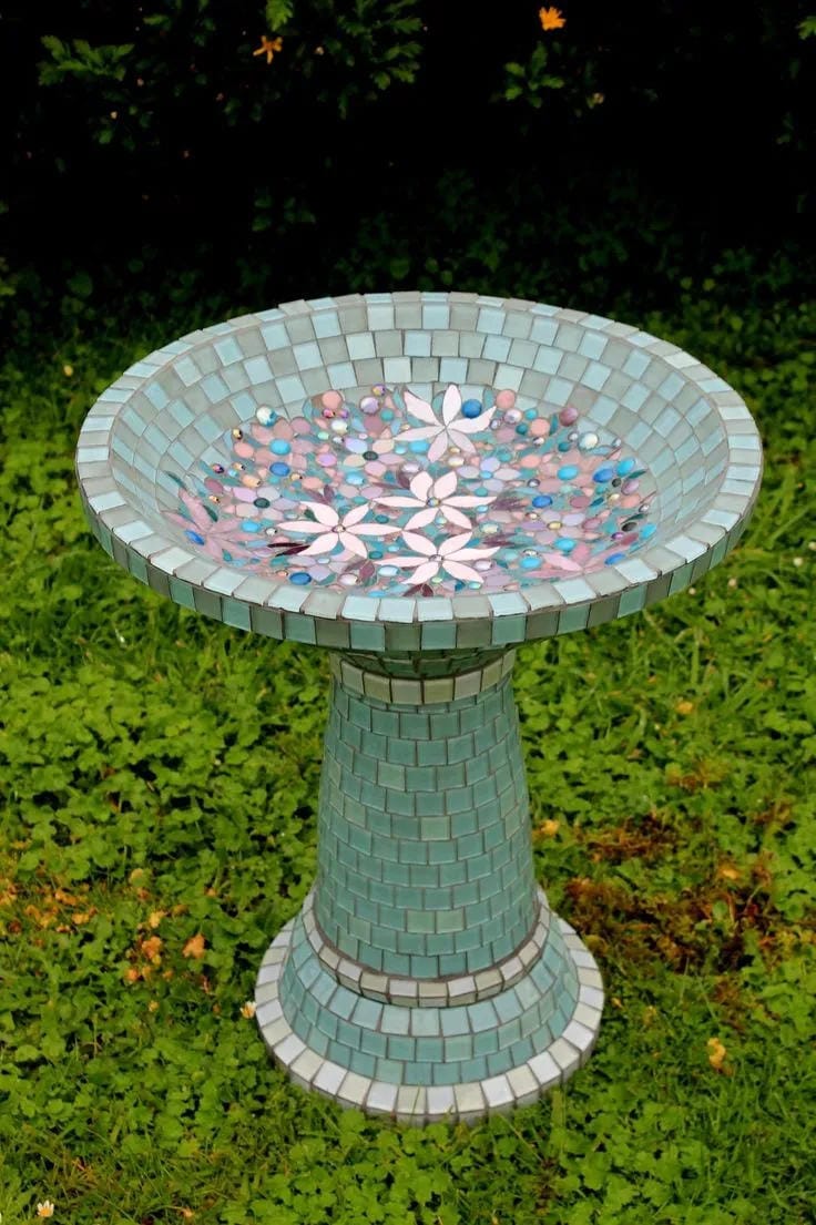 DIY bird bath idea with mint green mosaic pedestal and shallow bowl