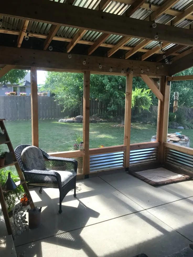 covered porch ideas with open wood structure black chair and concrete floor