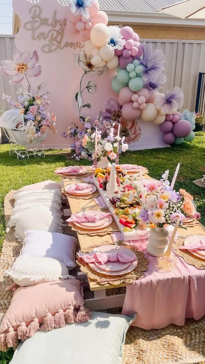 outdoor girl baby shower picnic table with pink balloons