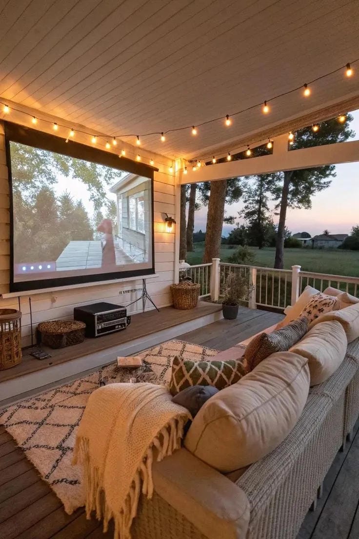 covered porch ideas with projector screen string lights sofa blankets and outdoor rug
