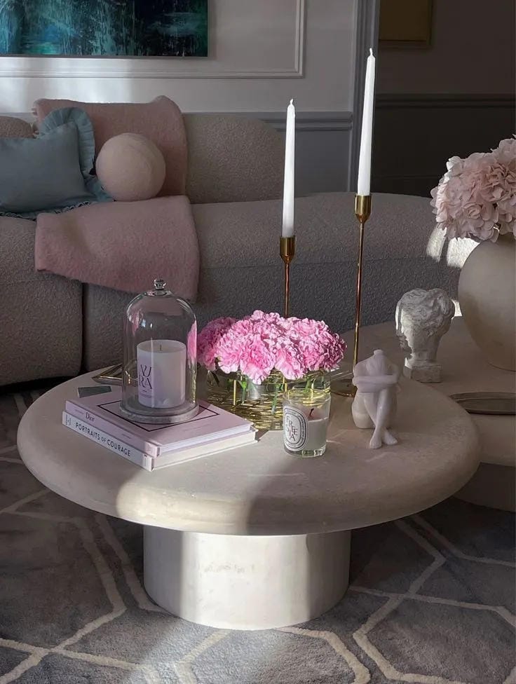 coffee table decor ideas with pink flowers taper candles books and round coffee table