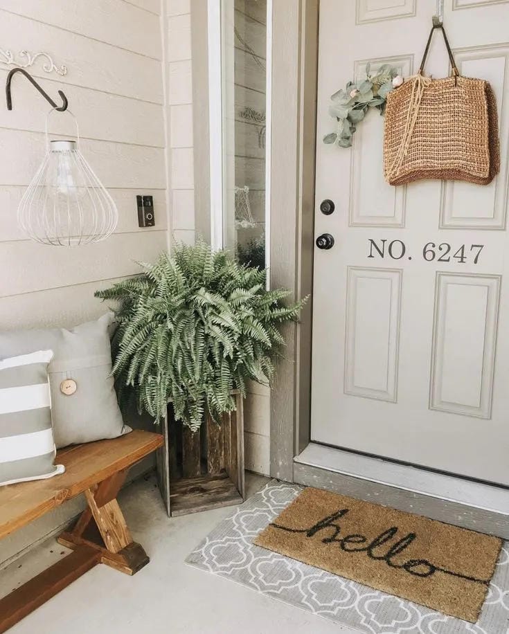 tiny front porch idea with seasonal flowers