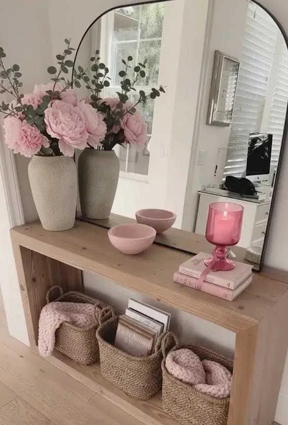 entryway table decor with baskets pink flowers round mirror and console table