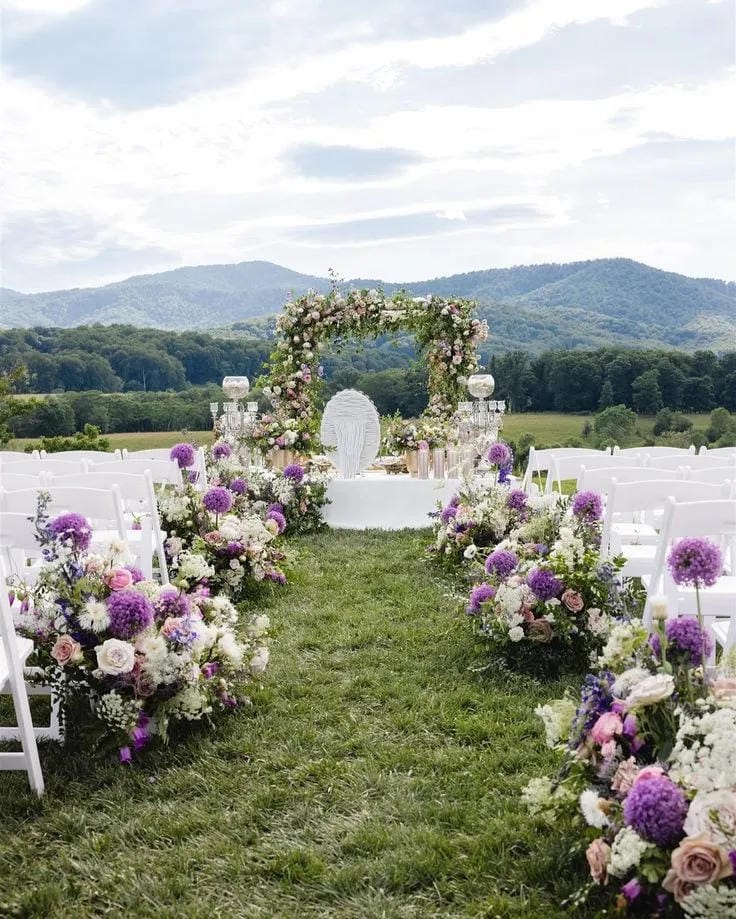 outdoor wedding aisle decoration with natural greenery