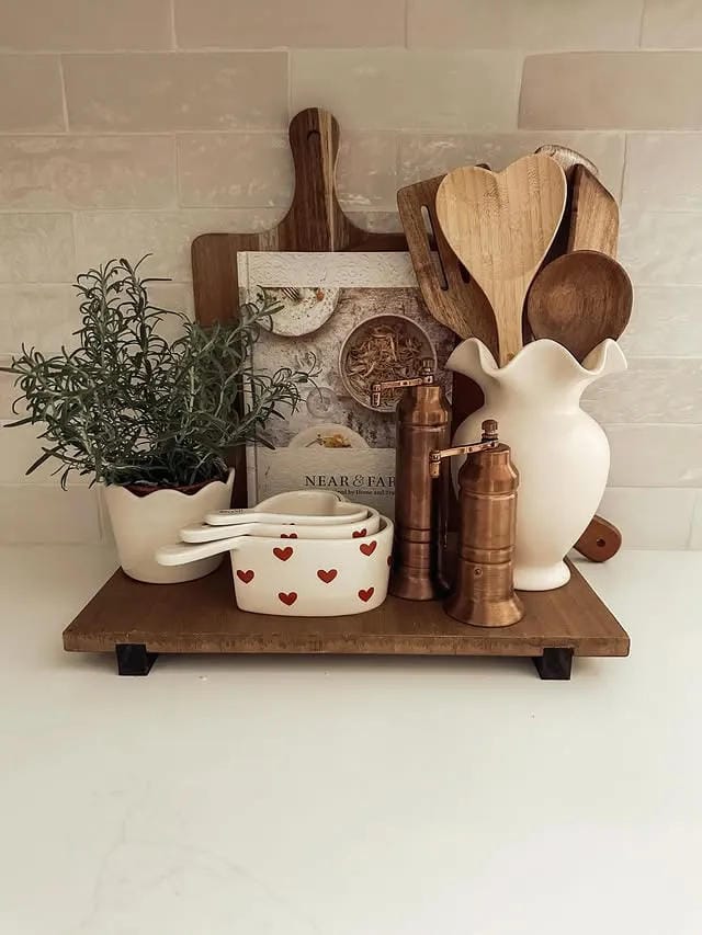 kitchen counter organization ideas with raised wood tray utensils pitcher and plant