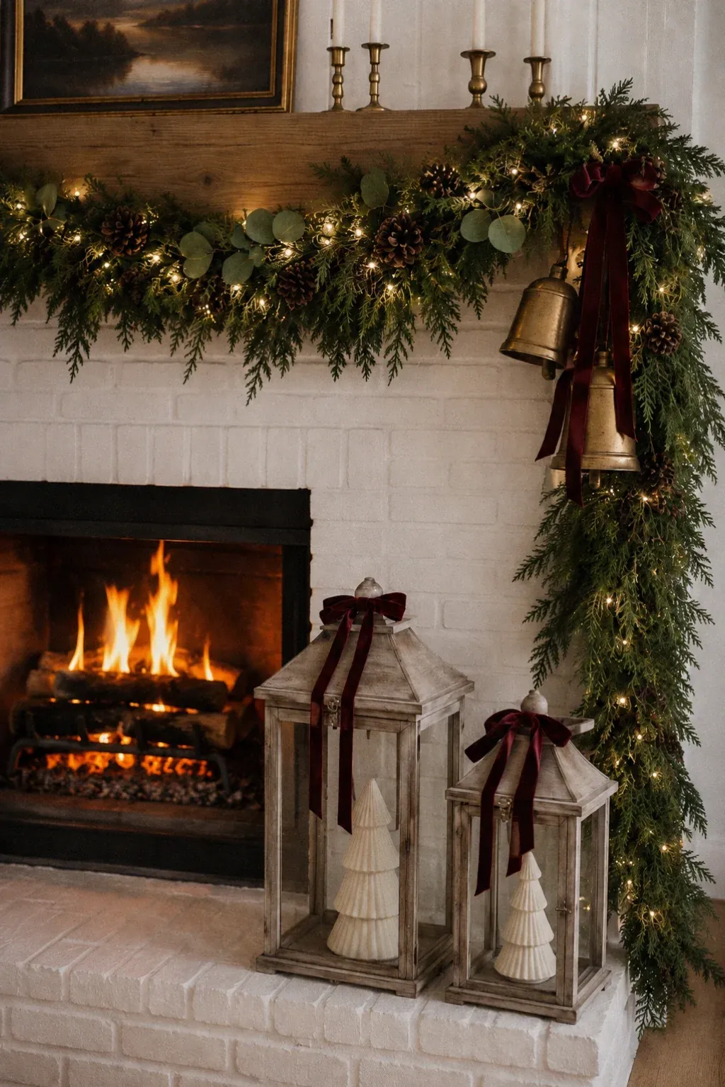 Christmas fireplace decor with garland and lanterns